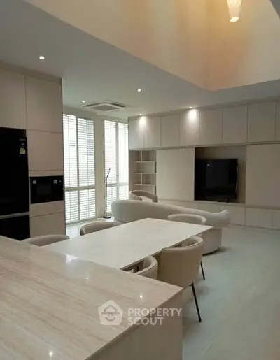 Spacious modern living room with elegant furniture and natural light