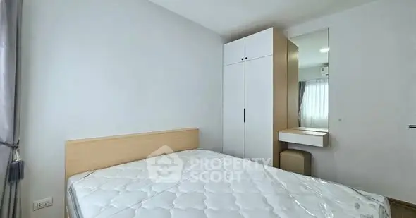 Modern bedroom with minimalist design and ample natural light