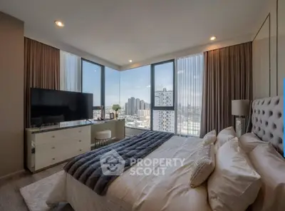 Luxurious bedroom with stunning city view and modern decor