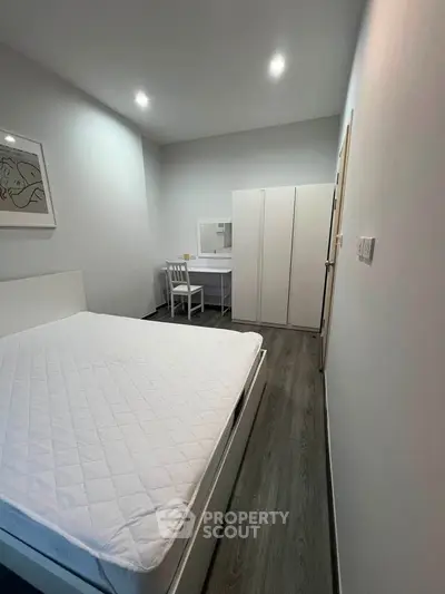 Modern minimalist bedroom with sleek furniture and stylish decor