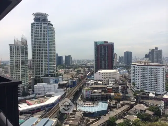 Stunning cityscape view from high-rise balcony in urban setting, showcasing modern architecture and vibrant skyline.