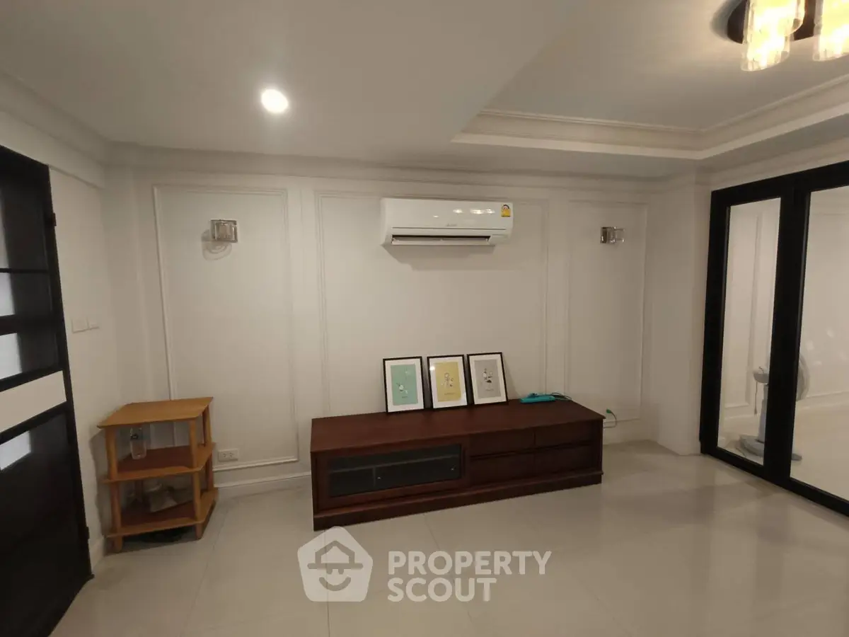 Spacious living room with modern air conditioning and elegant decor