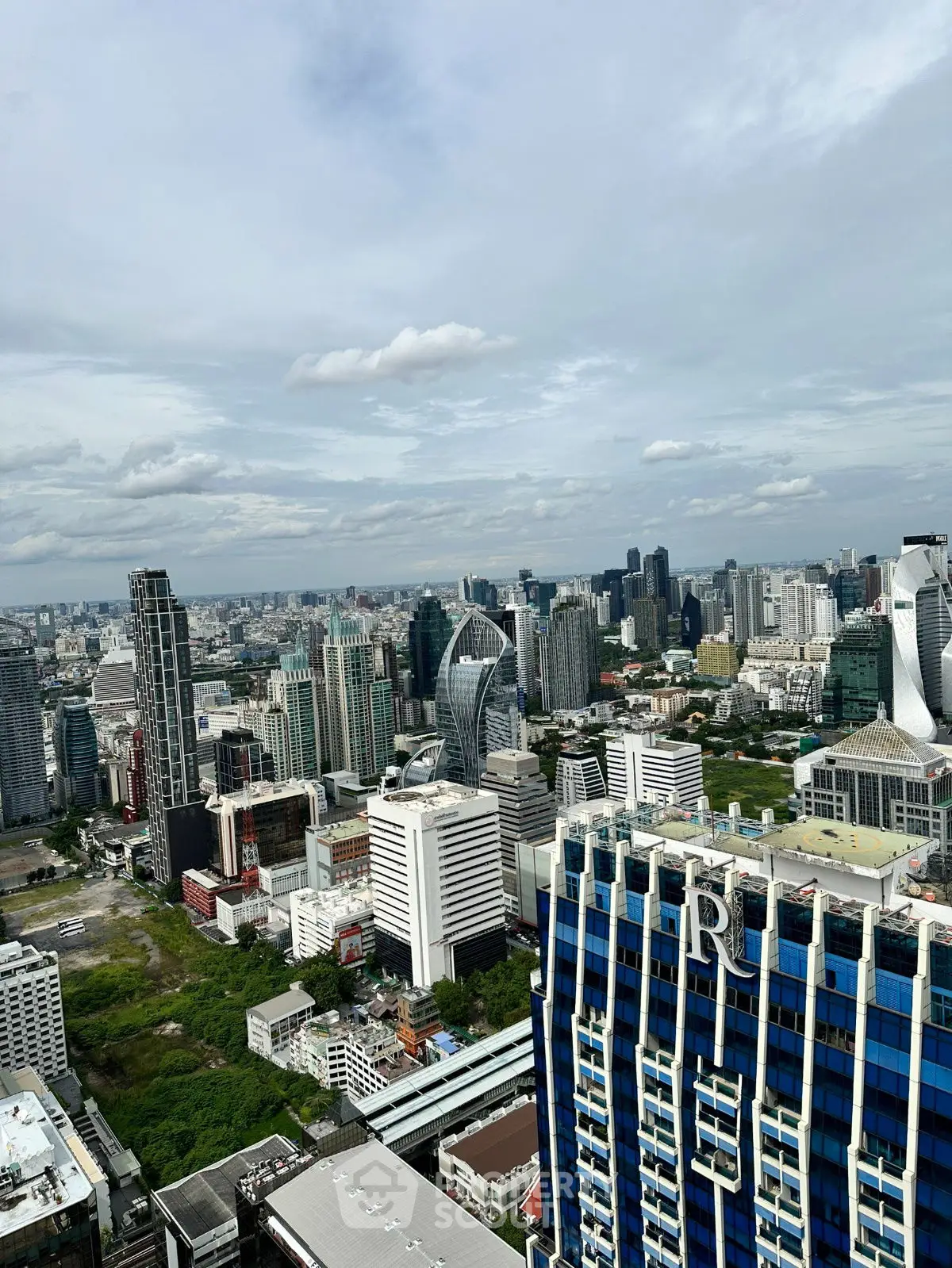 Stunning cityscape view from a high-rise building showcasing modern architecture and skyline.