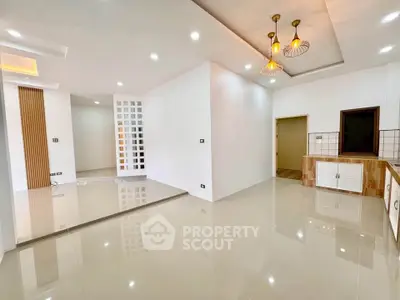 Spacious modern living room with elegant lighting and sleek flooring