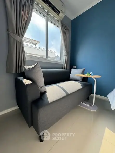 Cozy living room with modern sofa and natural light