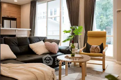 Stylish modern living room with cozy decor and natural light