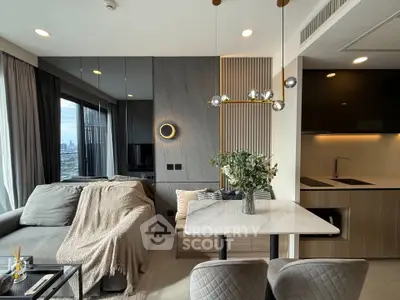 Modern living room with elegant decor and city view, featuring a cozy sofa and stylish dining area.
