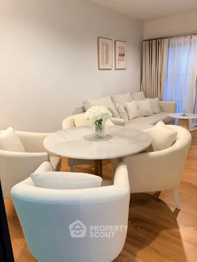 Elegant living room with cozy seating and stylish decor, perfect for relaxation and entertaining.