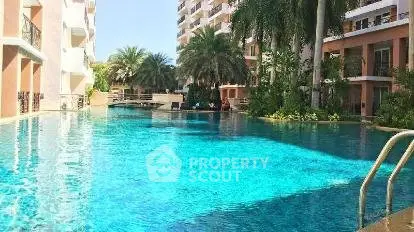 Luxurious residential pool with palm trees and modern architecture