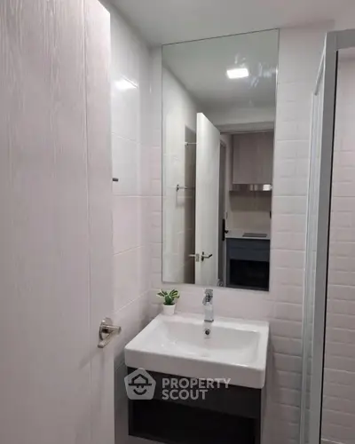 Modern bathroom with sleek sink and mirror design