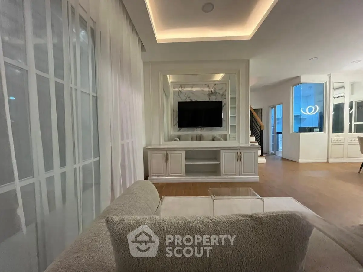Luxurious living room with modern decor and built-in TV unit