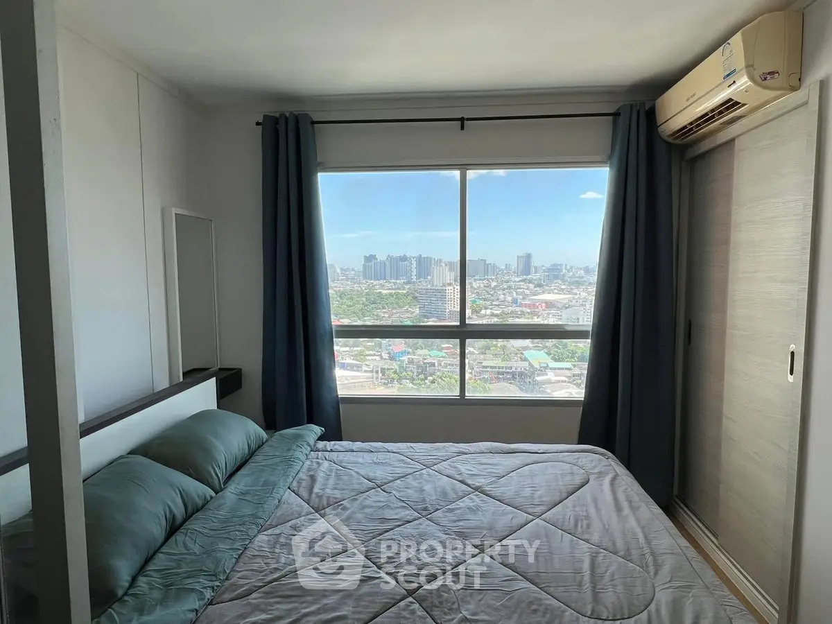Modern bedroom with large window offering stunning city views, featuring cozy bedding and air conditioning.
