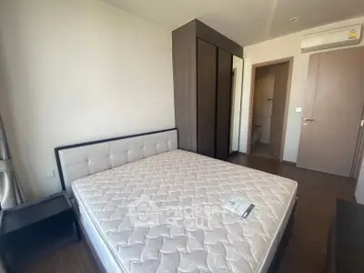 Spacious bedroom with modern furniture and ample natural light