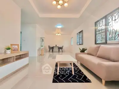 Spacious modern living room with elegant decor and ample natural light
