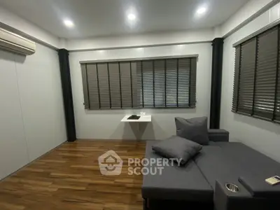 Modern living room with sleek design and wooden flooring