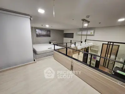 Modern loft bedroom with stylish lighting and open layout