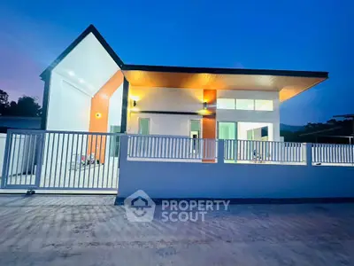 Modern single-story house with sleek design and spacious outdoor area, perfect for contemporary living.