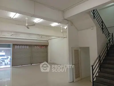 Spacious commercial property with high ceilings and ample natural light, ideal for retail or office use.