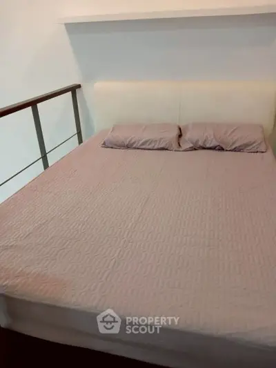 Cozy bedroom with modern design and comfortable bed in stylish apartment