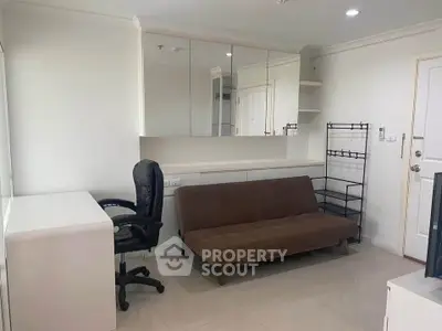 Modern living room with sleek furniture and ample storage space
