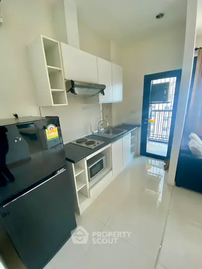 Modern compact kitchen with sleek appliances and open layout