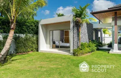 Luxurious modern villa with lush garden and palm trees, featuring sleek architecture and spacious outdoor area.