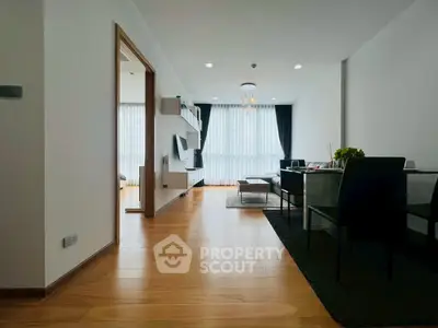 Spacious modern living room with wooden flooring and elegant decor
