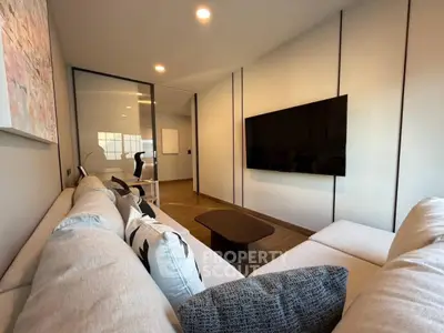 Modern living room with sleek design and wall-mounted TV