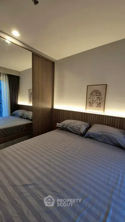 Modern bedroom with stylish wood paneling and ambient lighting