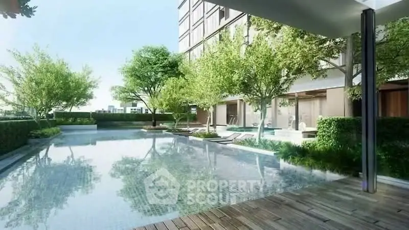 Luxurious residential pool area with lush greenery and modern design.