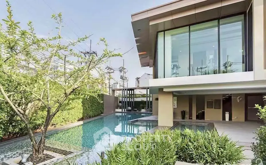 Luxurious modern home with private pool and lush garden