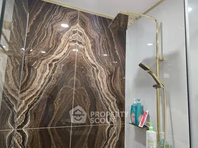 Luxurious bathroom with elegant marble shower and modern fixtures