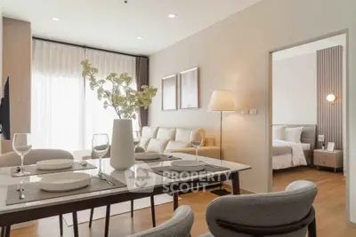 Modern open-plan living and dining area with elegant decor and natural light