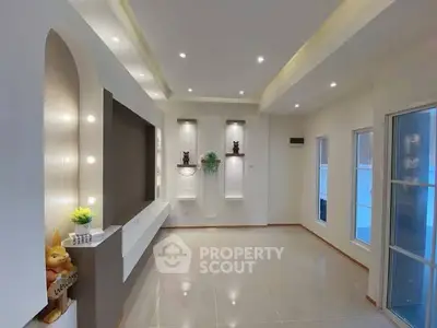 Modern living room with sleek lighting and elegant decor, perfect for stylish urban living.