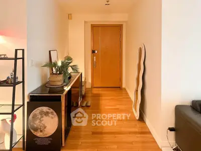 Stylish apartment hallway with wooden flooring and modern decor