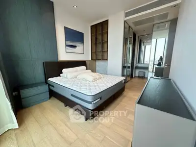Luxurious modern bedroom with elegant decor and large windows offering stunning views.