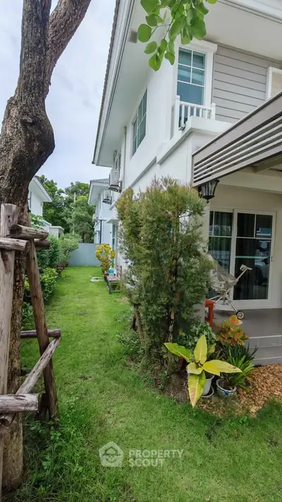 Charming suburban home with lush garden and cozy patio, perfect for family living.
