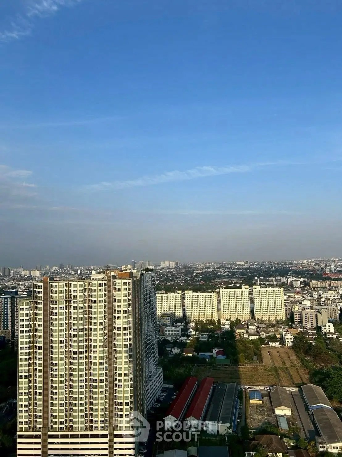 Stunning cityscape view from high-rise building showcasing urban living.