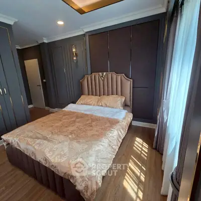 Luxurious bedroom with elegant decor and natural light