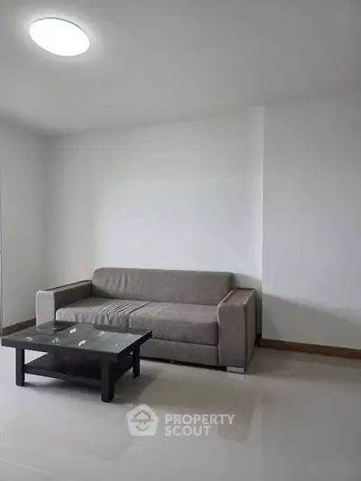 Modern minimalist living room with sleek sofa and coffee table