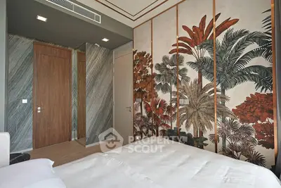 Stylish bedroom with tropical-themed wallpaper and modern design elements.