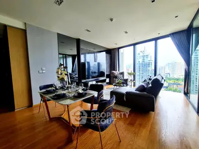 Luxurious living room with panoramic city views and elegant dining area