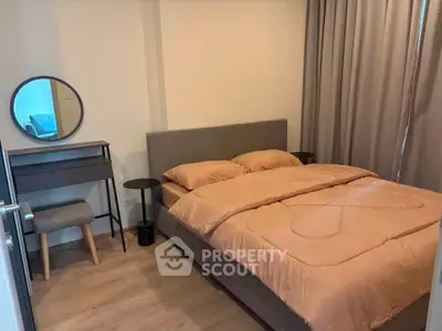 Cozy bedroom with modern furniture and warm lighting, perfect for relaxation and comfort.