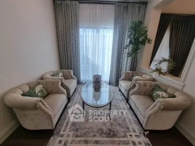Elegant living room with plush sofas and stylish decor, perfect for relaxation and entertaining guests.