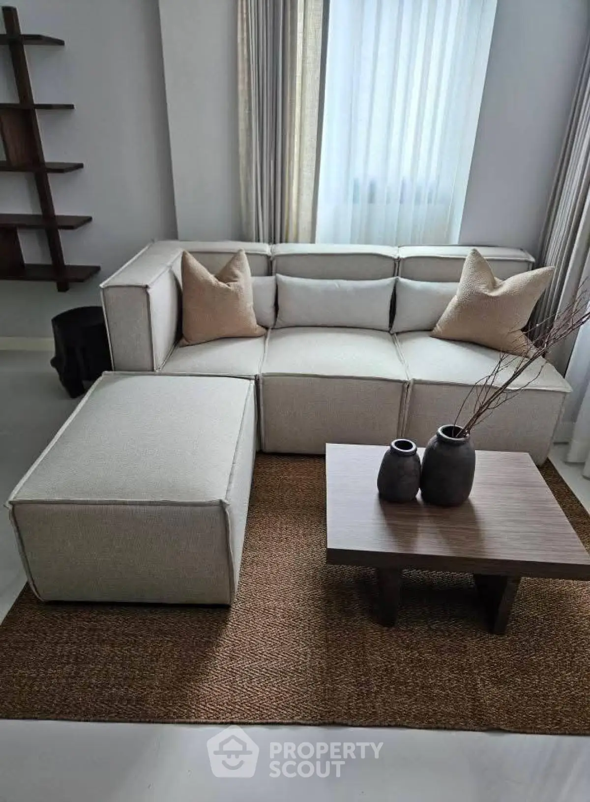 Modern living room with stylish sofa and coffee table, perfect for cozy gatherings.