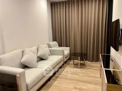 Modern living room with cozy sofa and sleek TV setup