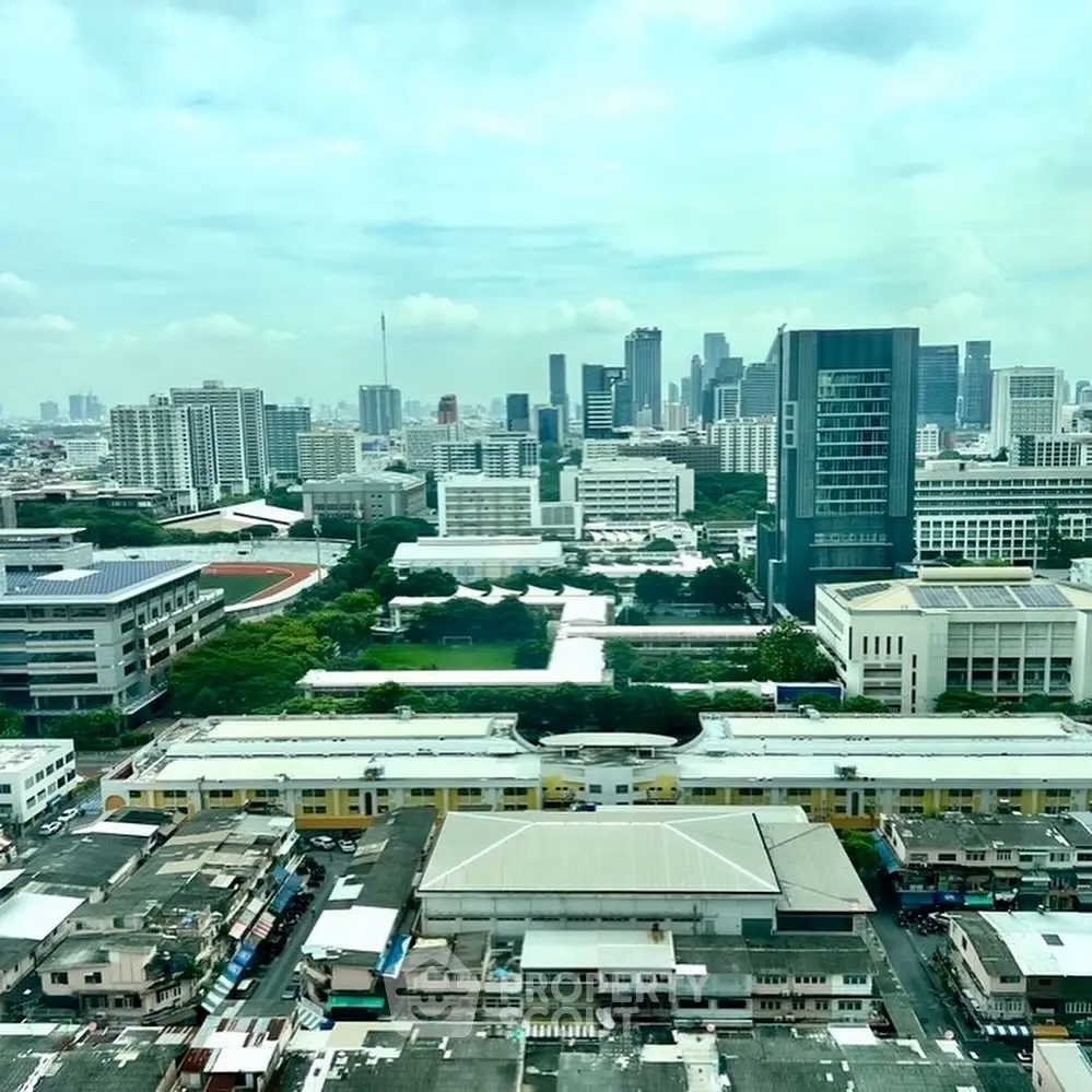 Stunning cityscape view from a high-rise building showcasing urban skyline and architecture.