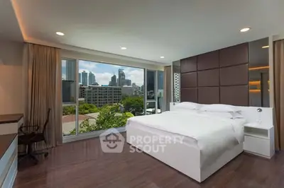Luxurious bedroom with stunning city view and modern decor