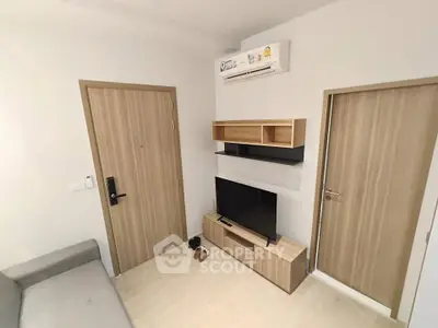 Modern living room with sleek furniture and air conditioning unit