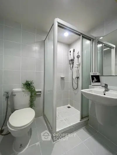 Modern bathroom with sleek shower enclosure and contemporary fixtures